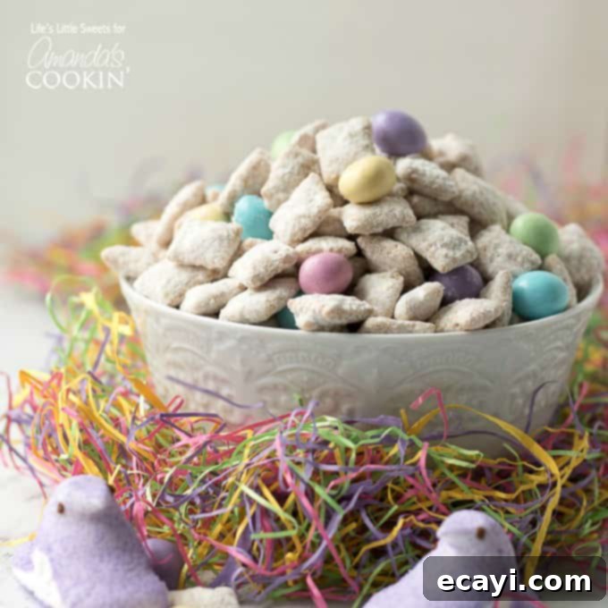 Easter Muddy Buddies are a sweet and salty snack with cereal. Then coated in white chocolate & peanut butter, customized with your favorite Easter candies. #snack #easter #easterdessert #easterrecipes #muddybuddy #puppychow #candy #chexmix #whitechocolate Colorful Easter muddy buddies