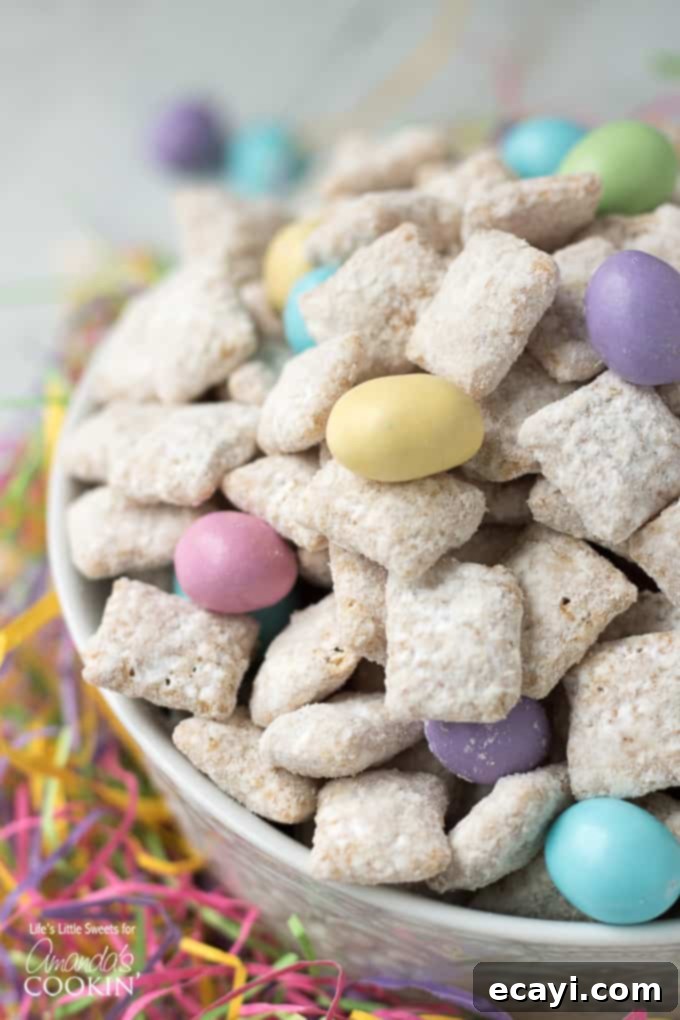 Easter Muddy Buddies are a sweet and salty snack with cereal. Then coated in white chocolate & peanut butter, customized with your favorite Easter candies. #snack #easter #easterdessert #easterrecipes #muddybuddy #puppychow #candy #chexmix #whitechocolate Easter Muddy Buddy recipe