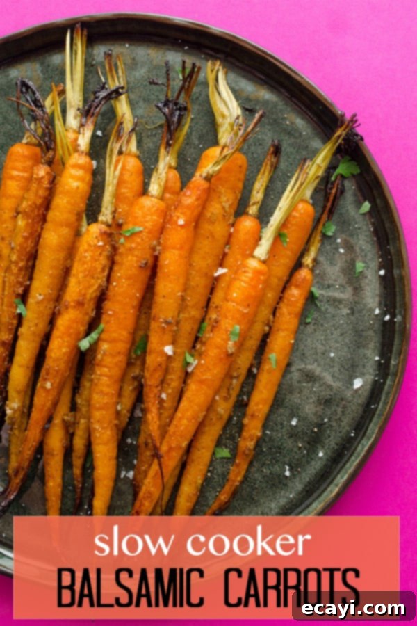 Slow-Cooked Balsamic Glazed Carrots 6 carrots on a black plate