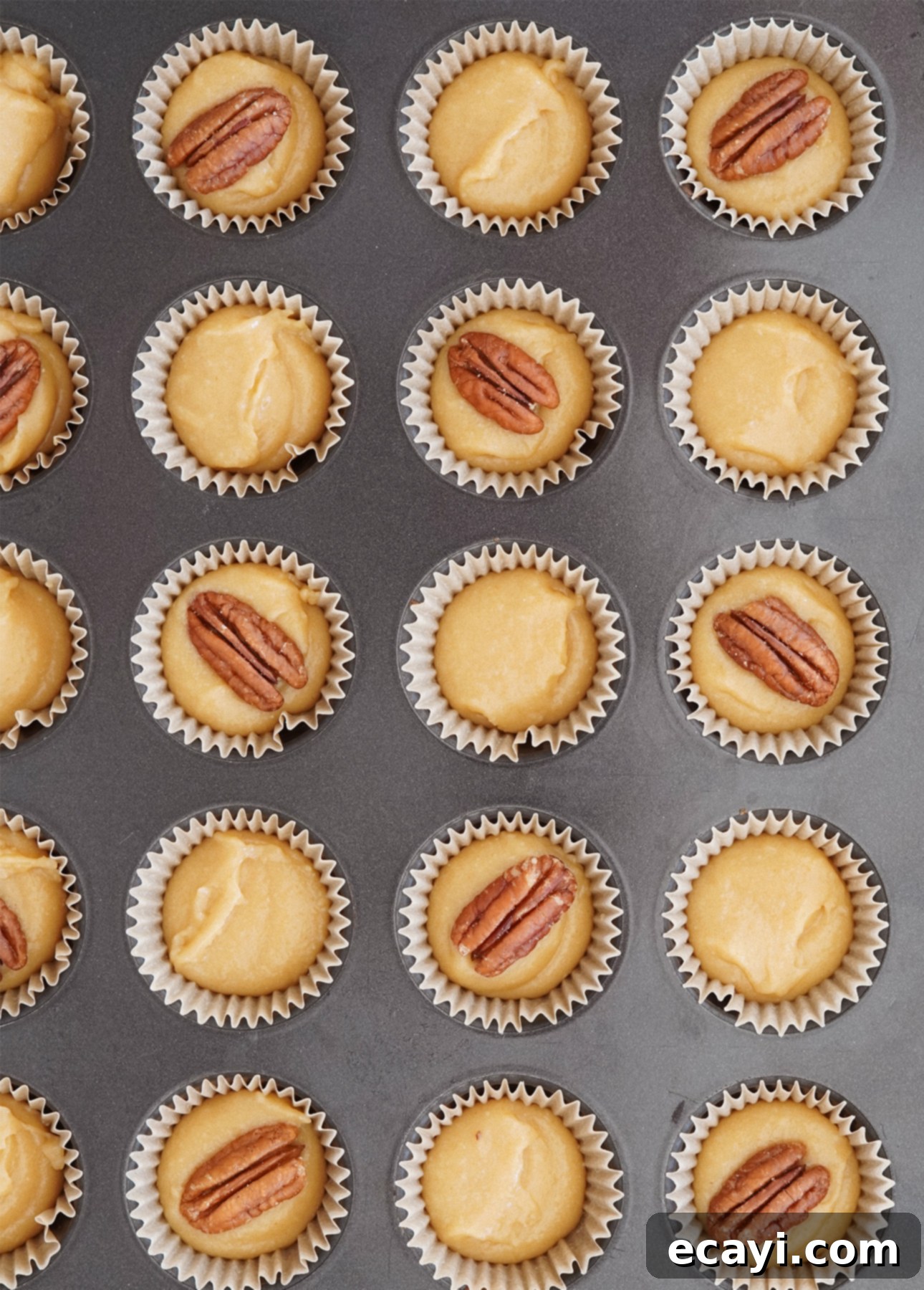 Quick and Delicious Maple Financiers 7 Maple financiers with decorative pecan nuts, before baking // FoodNouveau.com