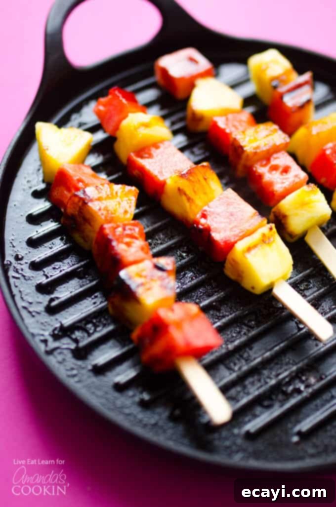 Quick & Easy Grilled Watermelon Pineapple Skewers with Yogurt Sauce Grilled Watermelon and Pineapple Skewers sizzling on a grill pan, ready for a delicious summer dessert. These fruit skewers are brushed with a honey-lime glaze and served with a simple yogurt dip.
