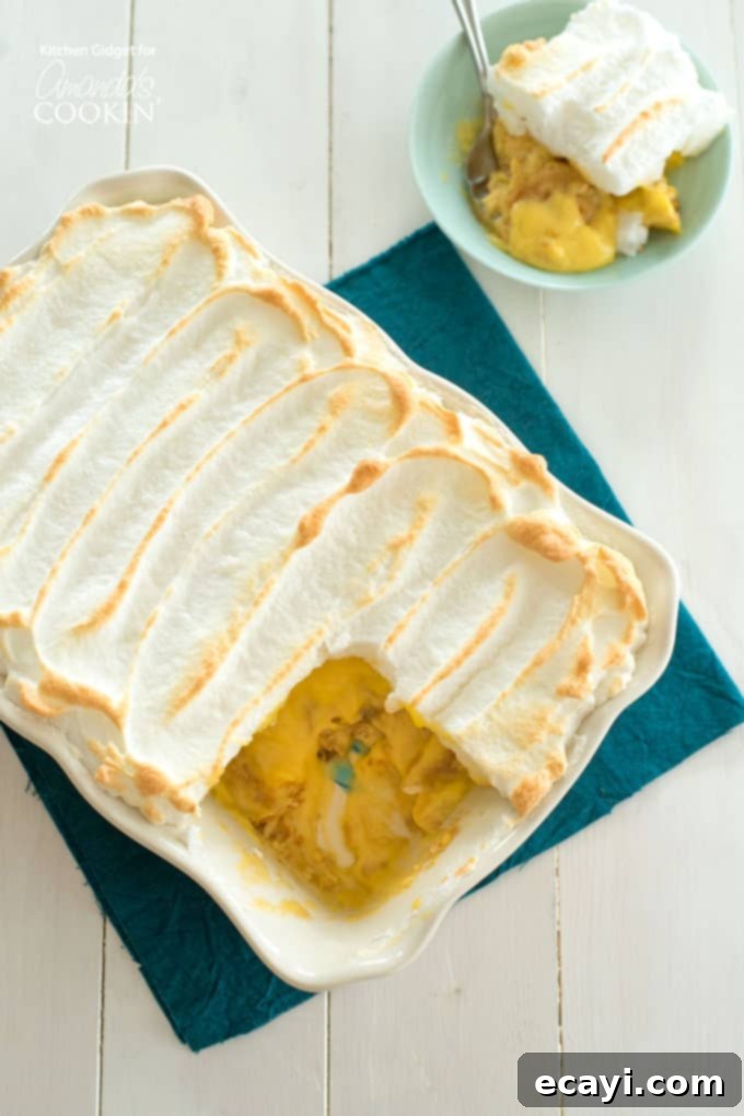Comforting Homemade Banana Pudding 2 Delicious homemade banana pudding with a golden meringue topping in a clear dish