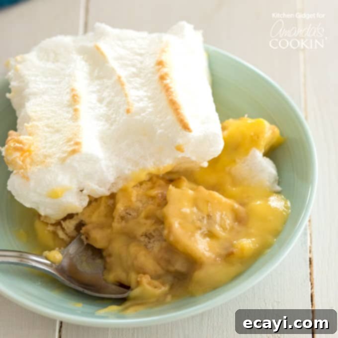Comforting Homemade Banana Pudding 3 A large bowl of Homemade Banana Pudding with layered vanilla wafers, bananas, and a golden meringue