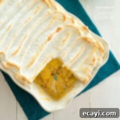 Comforting Homemade Banana Pudding 6 a pan of banana pudding with meringue topping and a slice removed for serving