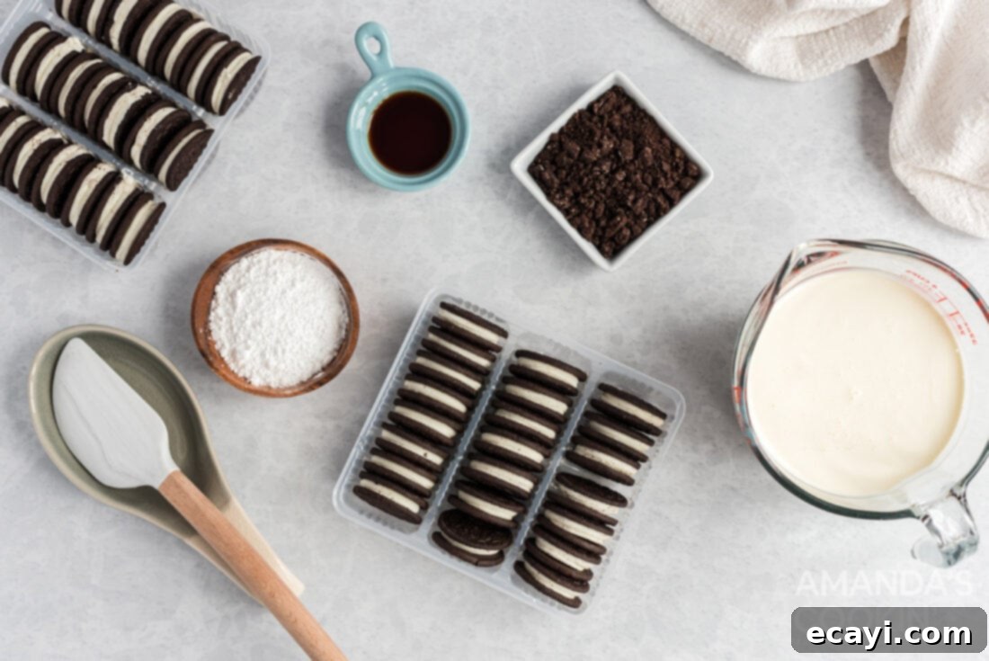 No-Bake Oreo Delight 4 A collection of ingredients for Oreo Icebox Cake, including packages of Oreos, heavy cream, powdered sugar, and vanilla extract.
