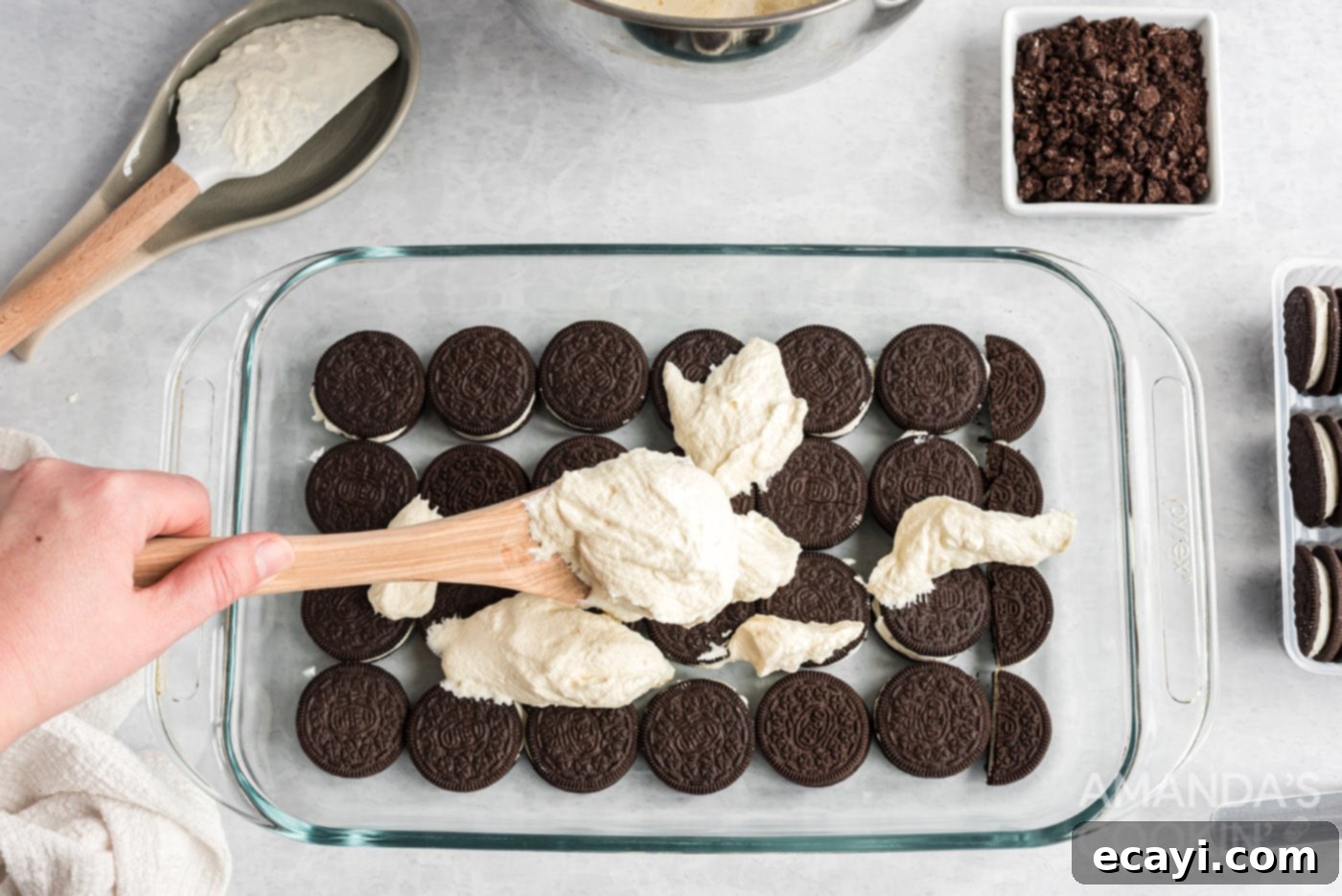 No-Bake Oreo Delight 6 A single layer of Oreo cookies arranged at the bottom of a baking dish, ready for the next layer.