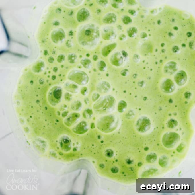 This Cucumber Tropical Smoothie packs in fruits and leafy green veggies, getting you fueled for your day (without the taste of a typical green smoothie). #tropical #smoothierecipes #tropicalsmoothie #cucumber #healthysmoothie #greensmoothie #breakfast #breakfastsmoothie cucumber smoothie in blender
