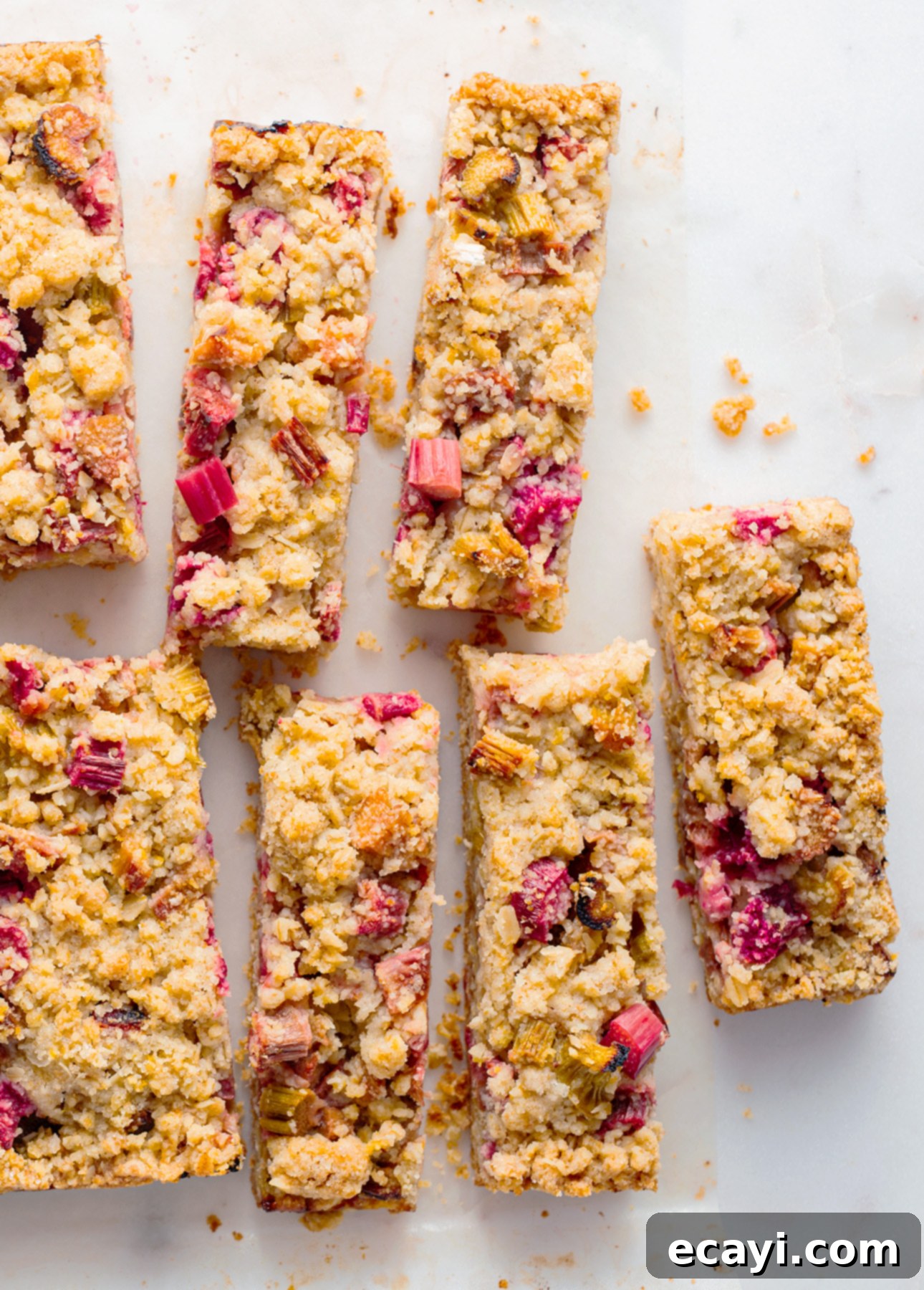 Sunshine Rhubarb Orange Crumble Bars 10 Close-up of a single perfect orange rhubarb crumb bar, showcasing its layers and texture. // FoodNouveau.com