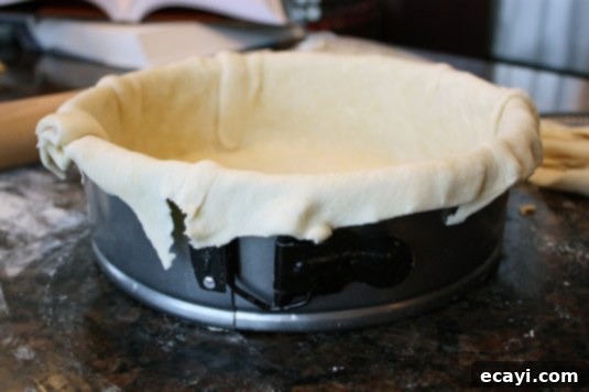 The Ultimate Quiche Lorraine 9 Making quiche lorraine: Lay the dough into the mold – there should be plenty of dough overhanging the edges to help it maintain its shape.
