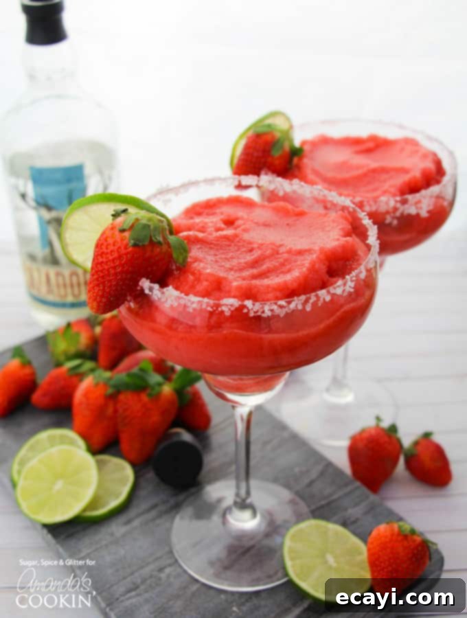 Sparkling Raspberry Gin Rickey 5 A refreshing pink cocktail in a elegant glass, garnished with edible flowers and berries, perfect for warm weather.