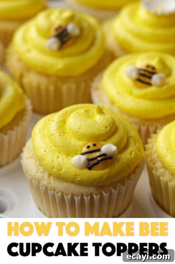 Sweet Honeybee Crowns 11 A stunning final shot of several bee-themed cupcakes, highlighting the homemade toppers and vibrant frosting
