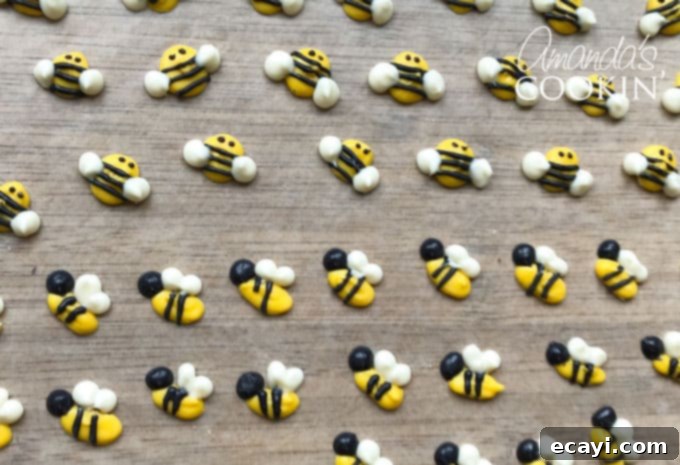Sweet Honeybee Crowns 7 A collection of finished candy melt bee cupcake toppers, showcasing variety in shape and detail