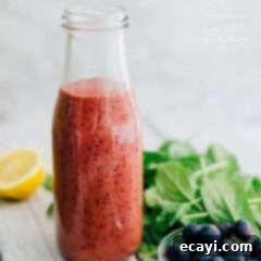 Blueberry Burst Vinaigrette 2 Blueberry Vinaigrette in a milk bottle, perfect for pouring over salads.