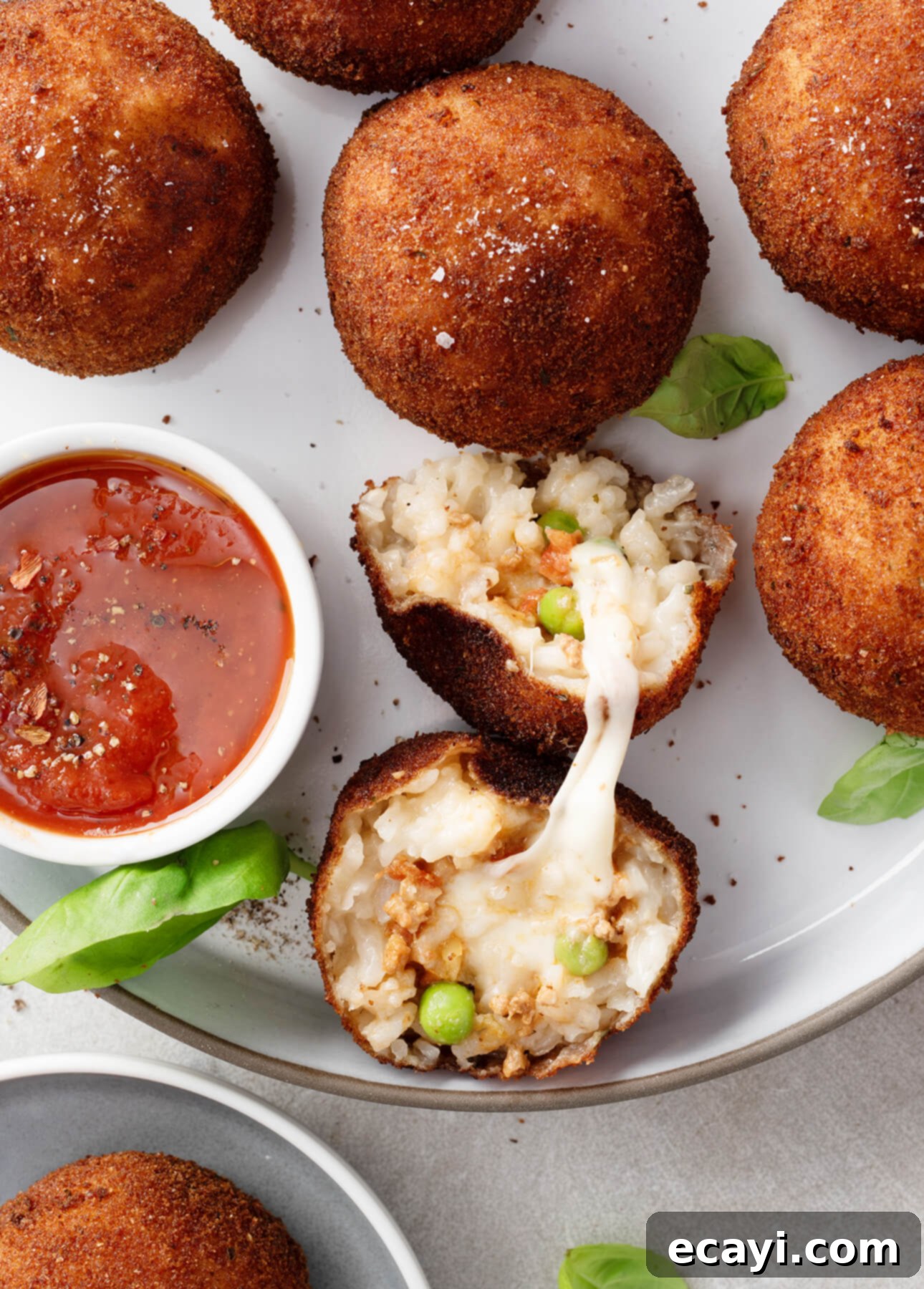 Comfort in a Bowl: 12 Creamy Risotto Recipes for Cooler Weather 5 How to Make Arancini (Fried Risotto Balls!) // FoodNouveau.com