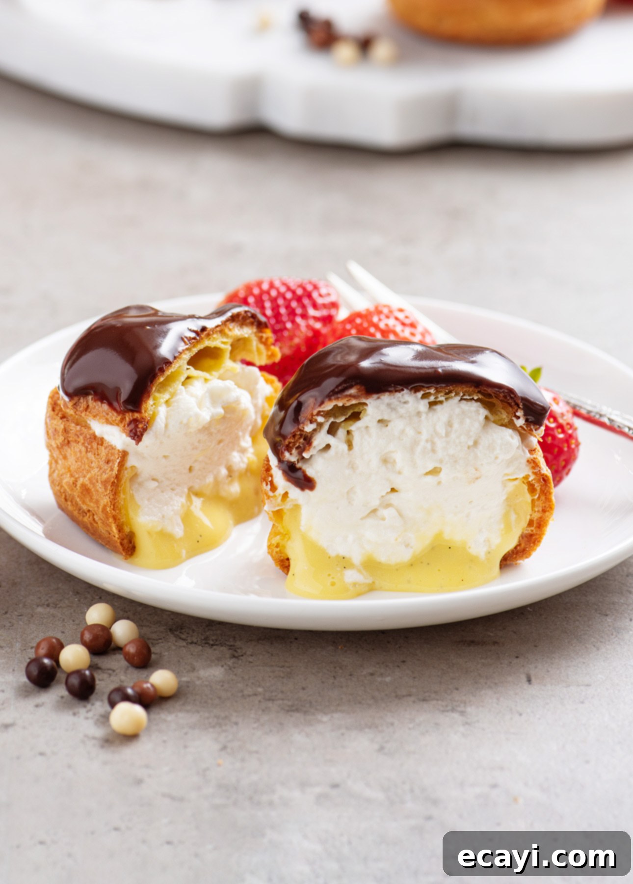 Bake Irresistible Cream Puffs 11 Classic French Cream Puffs showcasing a beautiful golden crust, ready to be filled // FoodNouveau.com