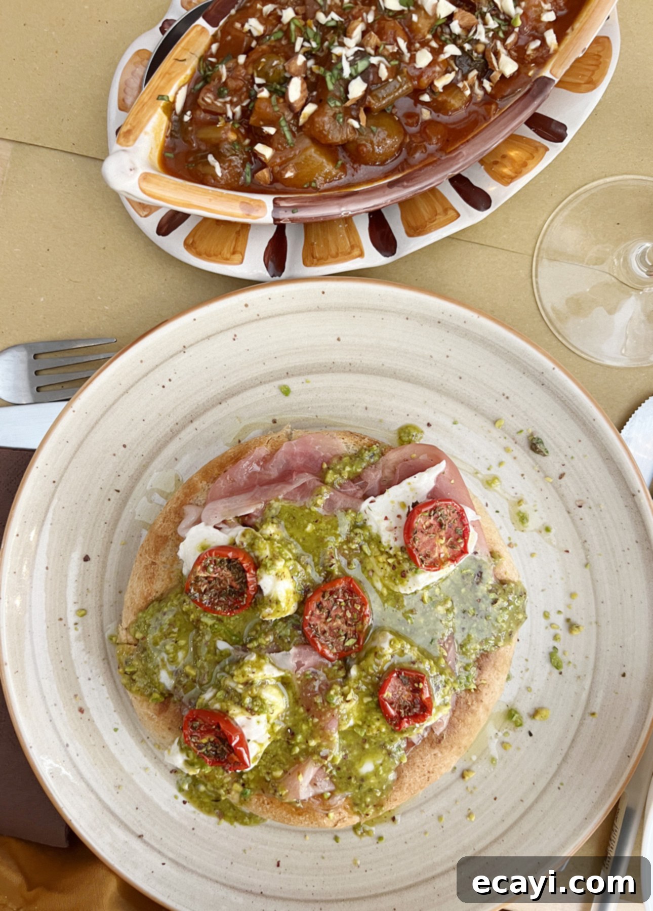 Bake Perfect No-Knead Focaccia Effortlessly 6 Focaccia topped with mortadella, cheese, and pistachio pesto in Sicily, Italy // FoodNouveau.com