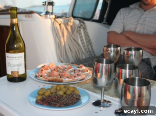 A fancy happy-hour with white wine, black pepper dry sausage, green olives and smoked salmon canapés. A fancy happy-hour with white wine, black pepper dry sausage, green olives and smoked salmon canapés.