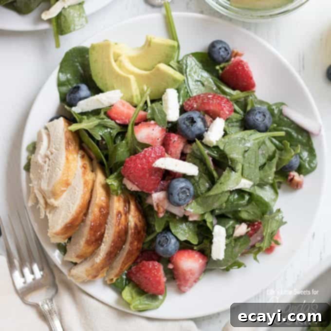 Vibrant Strawberry Salad 3 A beautifully plated Strawberry Salad, vibrant with red berries, green leaves, and white feta, ready to be served.