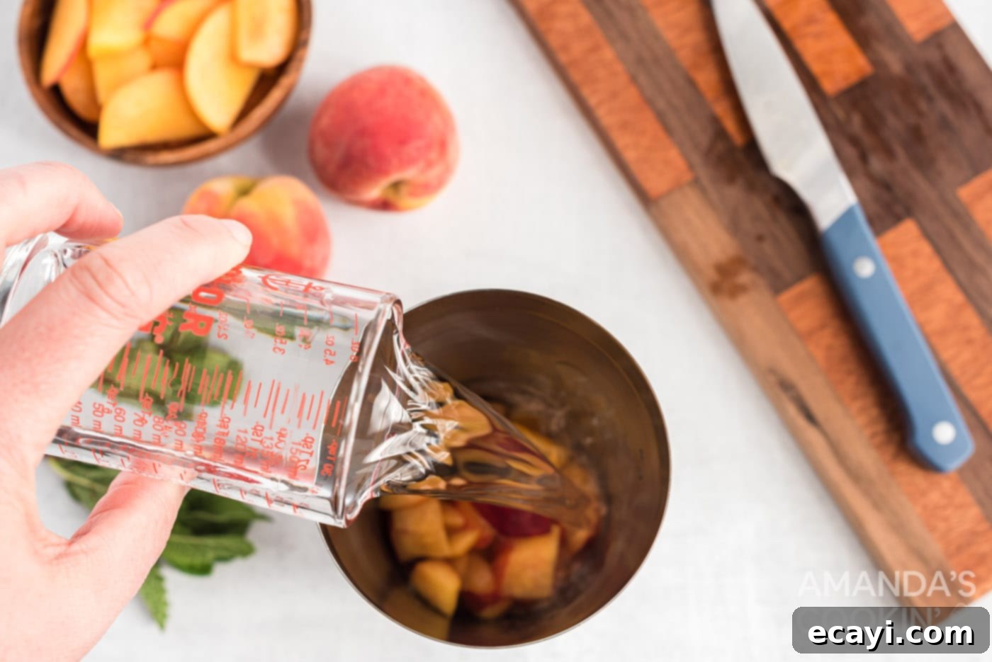 Peach Paradise Mojito 6 adding rum to chopped peaches