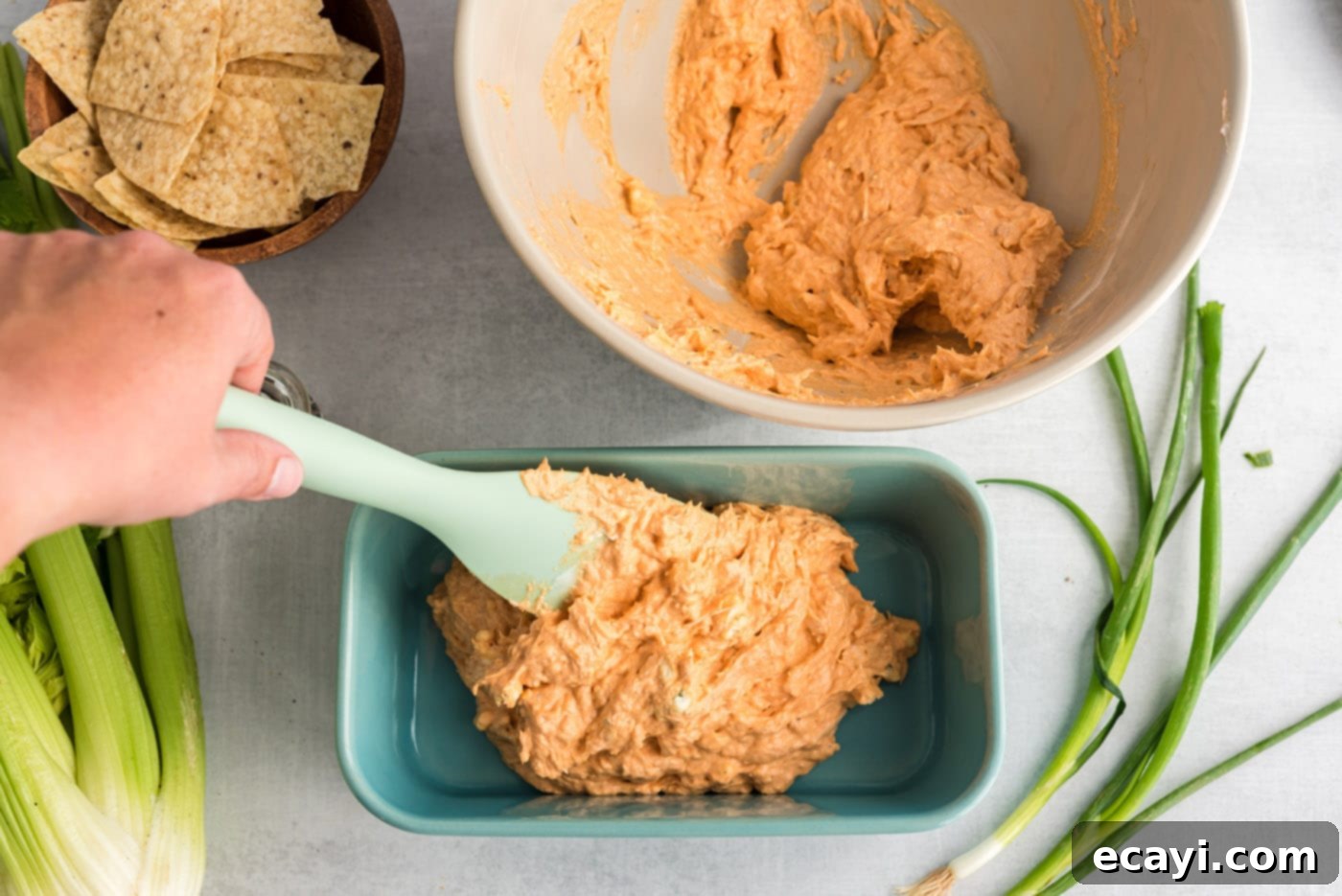 Ultimate Buffalo Chicken Dip 7 Buffalo Chicken Dip baked to perfection in a casserole dish, hot and bubbly, ready to serve.