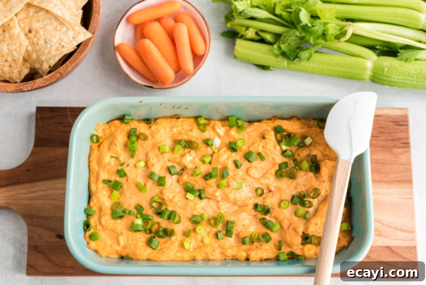 Ultimate Buffalo Chicken Dip 8 Buffalo Chicken Dip garnished with fresh chives, highlighting its creamy texture and vibrant color.