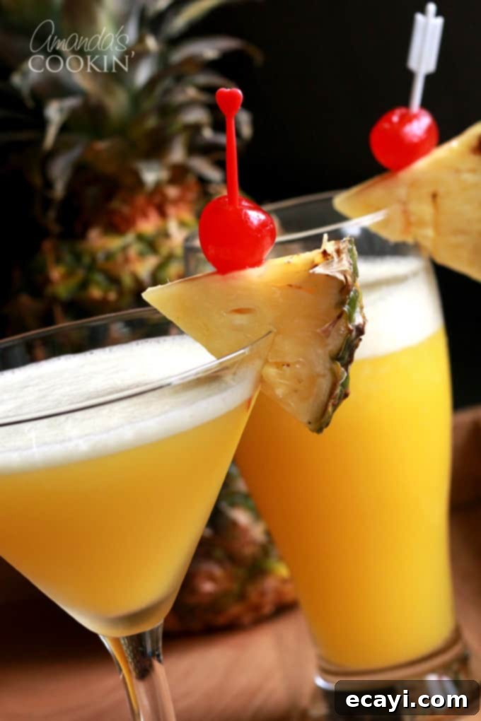 The Rum Cruiser Cocktail is a delicious blend of coconut rum, amber rum, banana liqueur, pineapple juice and orange juice. It's similar to a Rum Runner, but without the blackberry liqueur and grenadine. #comebacknew #cruisecocktail #alaskancruise #princesscruises #mixeddrinks #drinkswithrum #sponsored Rum Cruiser Cocktail - a vibrant tropical drink