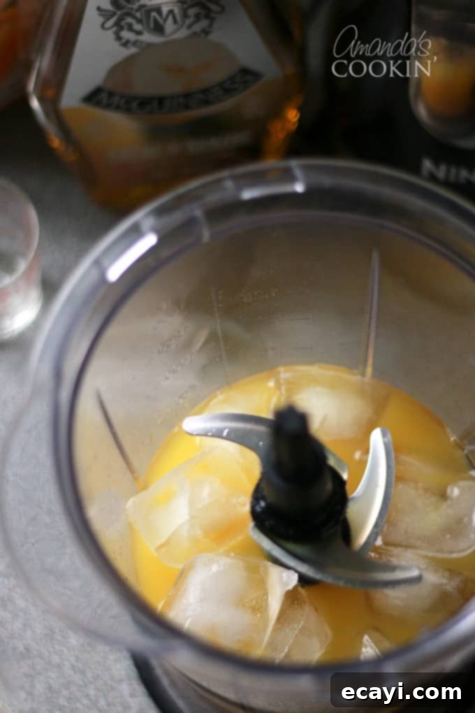 Rum Cruiser 5 blender filled with ice and liquid for a frozen cocktail