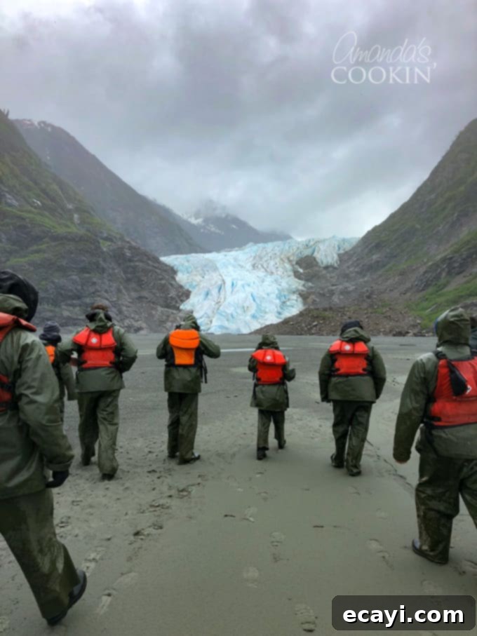 An unparalleled Alaska excursion idea: The Davidson Glacier Canoe Tour, guiding you through beautiful Alaska forests and out to a magnificent glacier! #alaskancruise #alaskaexcursion #canoetour #glaciertour #skagwayalaska #visitalaska #travelalaska #sponsored #princesscruises @princesscruises #comebacknew walk across black sand beach to davidson glacier in skagway, alaska