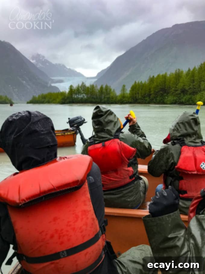 Experience an authentic Alaska excursion: The Davidson Glacier Canoe Tour takes you through beautiful Alaska forests and out to a magnificent glacier! #alaskancruise #alaskaexcursion #canoetour #glaciertour #skagwayalaska #visitalaska #travelalaska #sponsored #princesscruises @princesscruises #comebacknew people in canoe in alaska