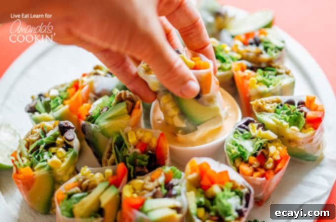 Mexican style summer rolls are the perfect healthy addition to your snacking routine! Mexican style summer rolls dipped into smoky chipotle sauce