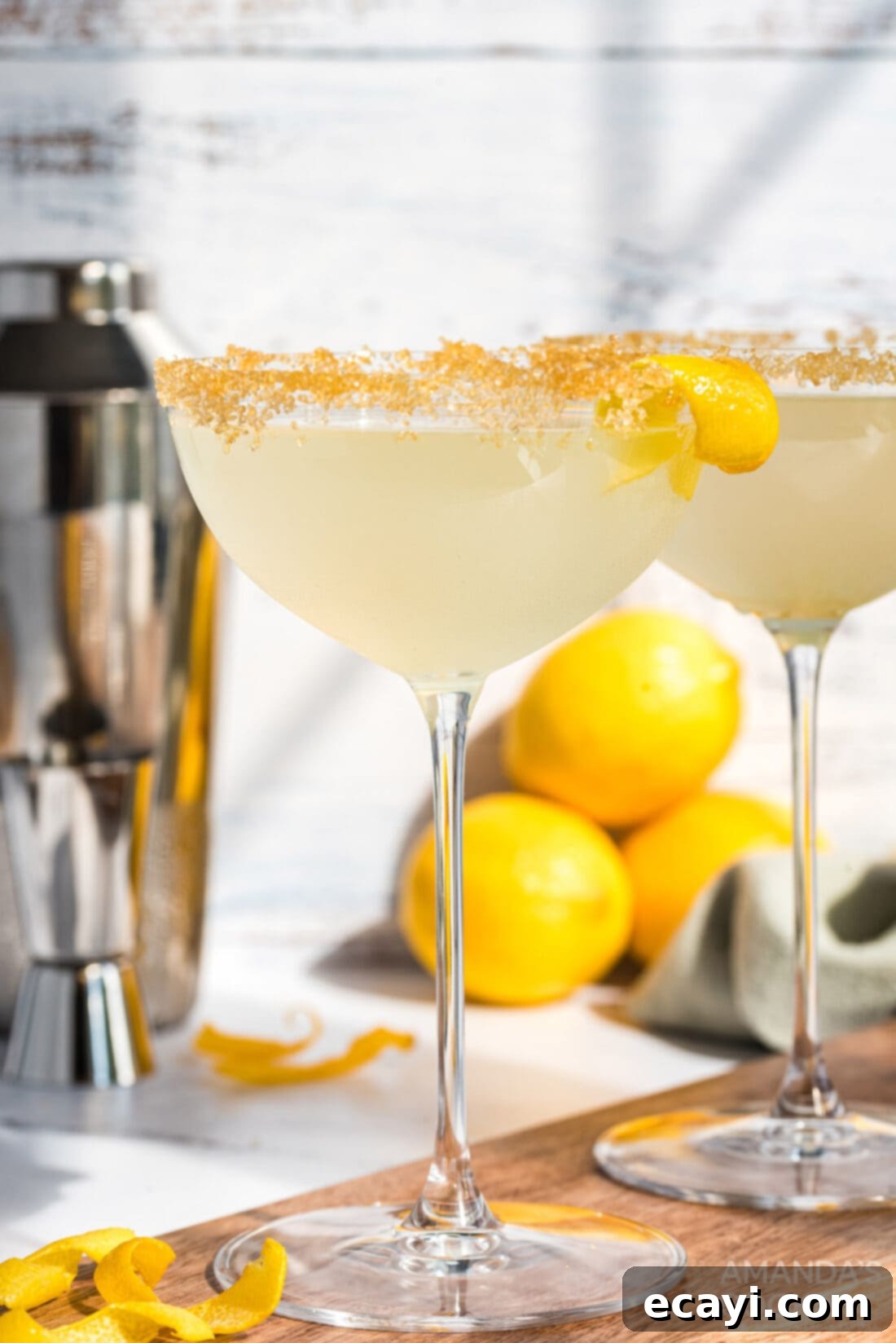 Sweet Tart Twinkle 2 Vibrant Lemon Drop Cocktail in a chilled martini glass, garnished with a sugared rim and lemon twist.
