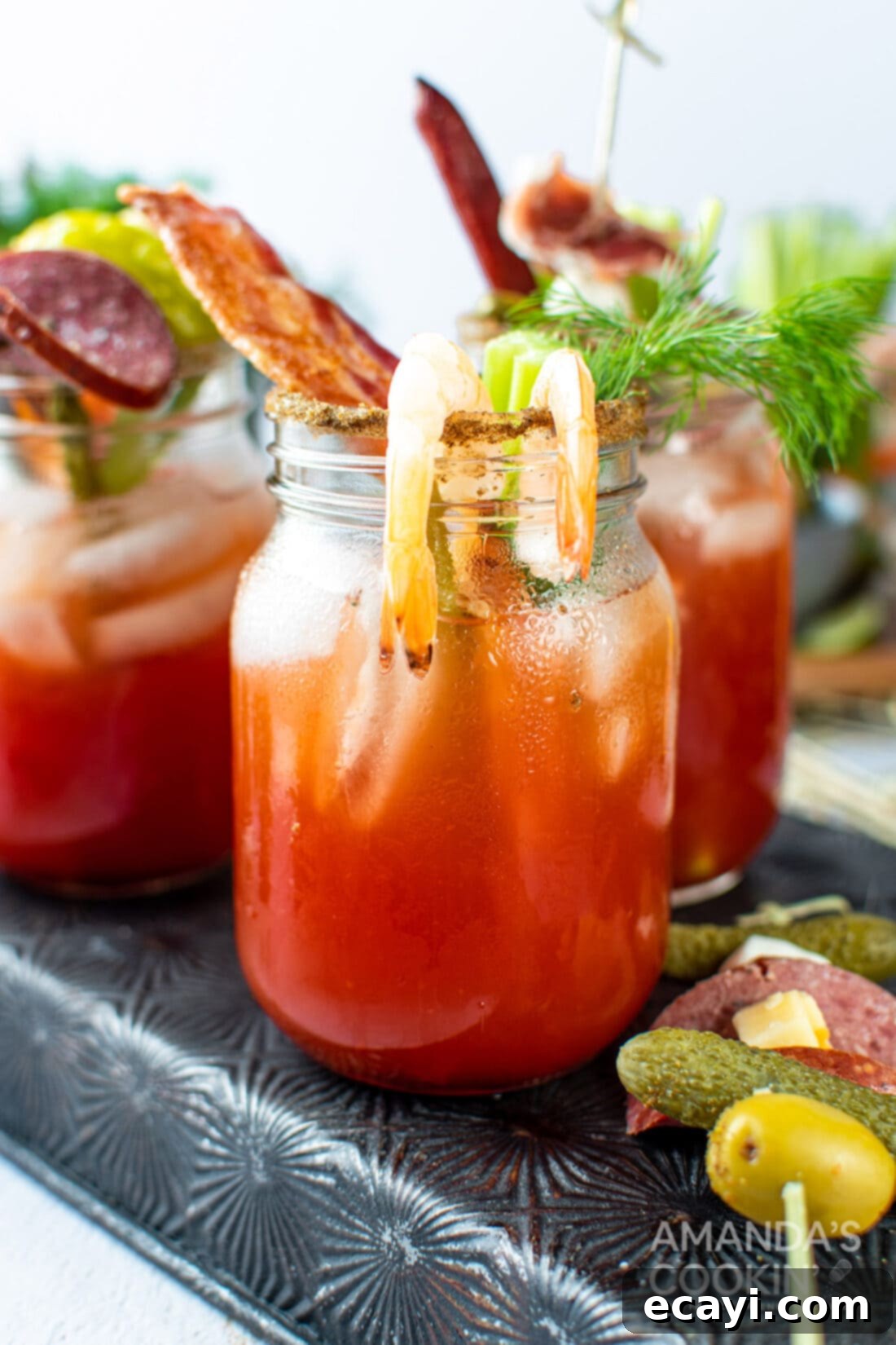 The Curse of Bloody Mary 2 Bloody Mary drink adorned with bacon and shrimp, ready for a gourmet brunch.
