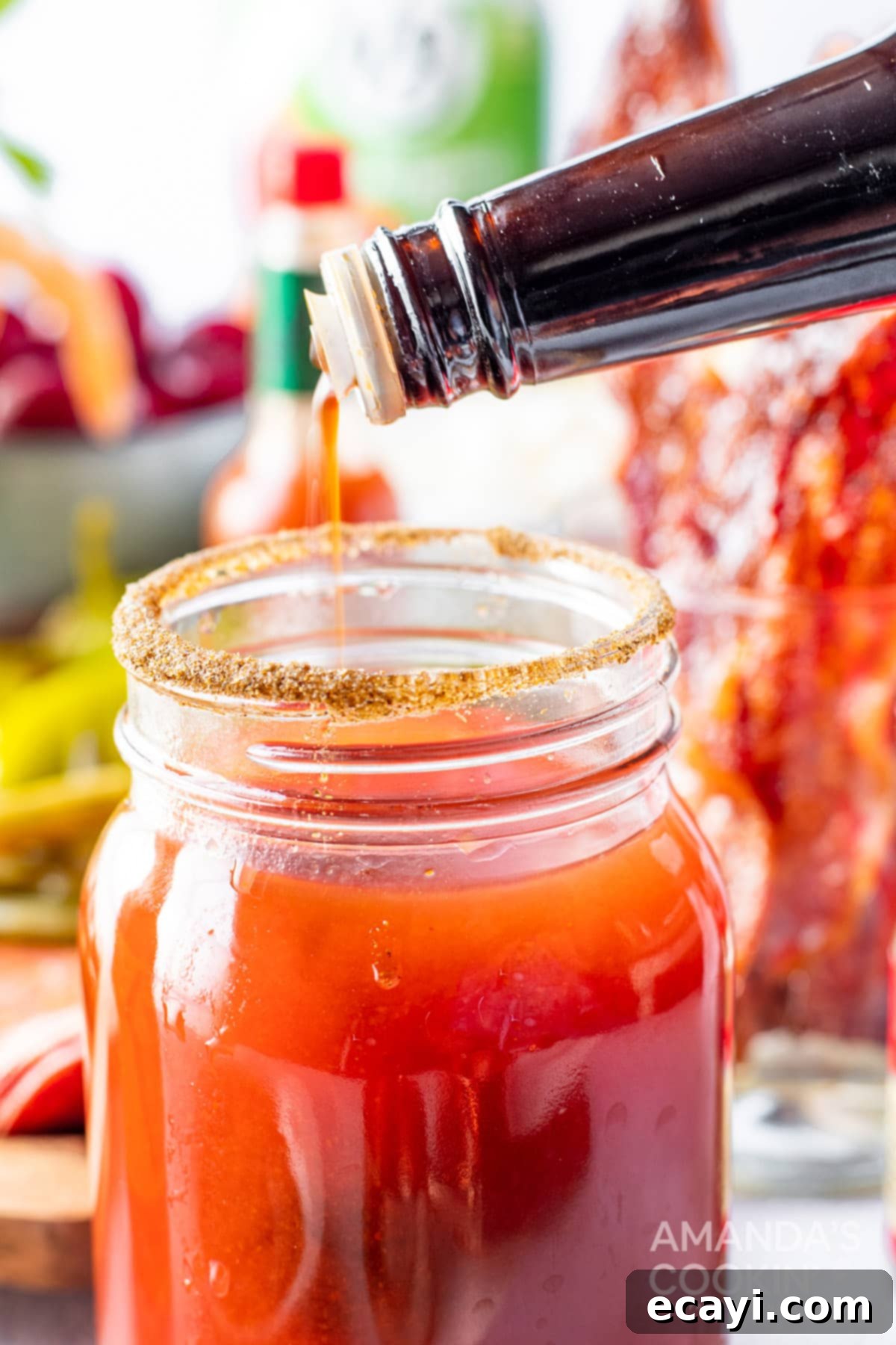 The Curse of Bloody Mary 8 Adding Worcestershire sauce to a Bloody Mary glass.