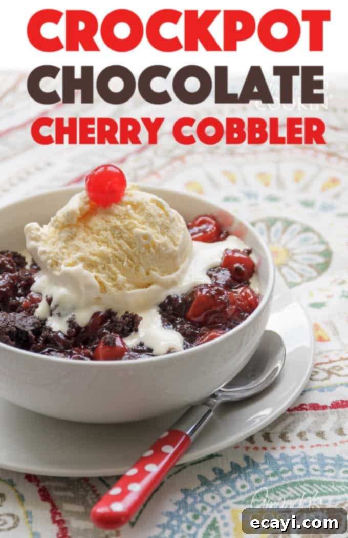 Savor the simplicity and deliciousness of this crockpot chocolate cherry cobbler – a Black Forest inspired dessert that's perfect for any occasion. #crockpotchocolatecherrycobbler #crockpotdesserts #blackforest #chocolatecobbler #chocolatecherrycobbler #crockpotcobbler #cakemixcobbler #cherrypiefilling #chocolatecakemix #crockpot #slowcooker #chocolatedesserts Close-up of a serving of warm crockpot chocolate cherry cobbler, highlighting its rich textures and colors.