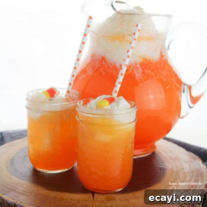 If you need Halloween food ideas for your Halloween party, be sure to check out all these sweet, savory and beverage ideas! Something for everyone. two glasses of candy corn punch with pitcher in background