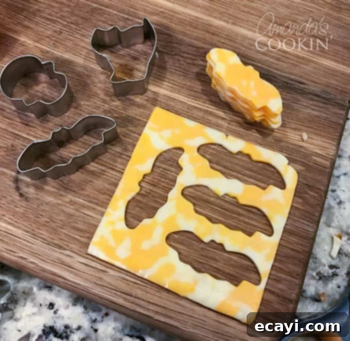 If you need Halloween food ideas for your Halloween party, be sure to check out all these sweet, savory and beverage ideas! Something for everyone. #halloweenrecipes #halloweenfoodideas #halloweenfood #halloweentreats #halloweenpartyfood #mummycookies #mozarellaeyeballs #spidertacodip #spidercookies #ricekrispypumpkins #ricekrispymonsters #dipinapumpkin #halloweenparty cookie cutter cheese