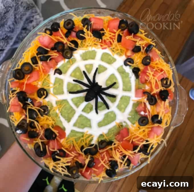 If you need Halloween food ideas for your Halloween party, be sure to check out all these sweet, savory and beverage ideas! Something for everyone. #halloweenrecipes #halloweenfoodideas #halloweenfood #halloweentreats #halloweenpartyfood #mummycookies #mozarellaeyeballs #spidertacodip #spidercookies #ricekrispypumpkins #ricekrispymonsters #dipinapumpkin #halloweenparty spider web taco dip