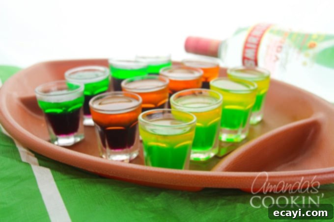 Kickoff Your Party: Football Jello Shots 3 Various football team jello shots in portable plastic containers, ready to serve