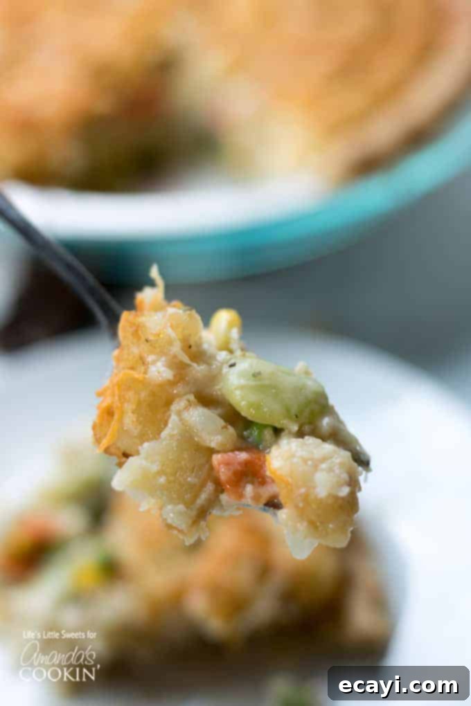 Fork full of Chicken Pot Pie Tater Tot Casserole Forkfull of Chicken Pot Pie Tater Tot Casserole