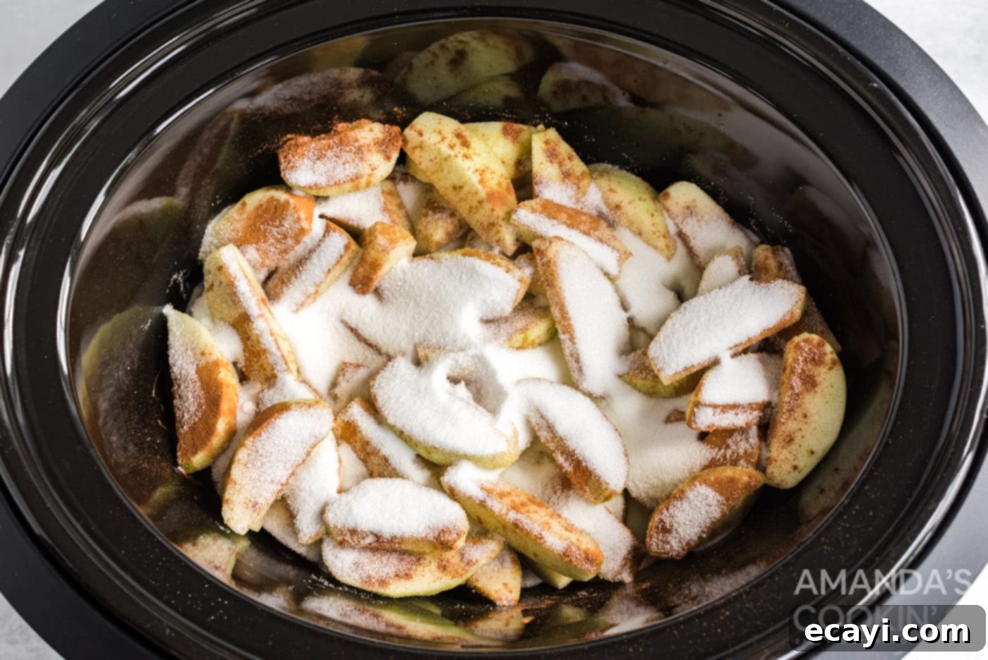Cozy Slow Cooker Cinnamon Apples 6 sugar and cinnamon on apple slices in crockpot