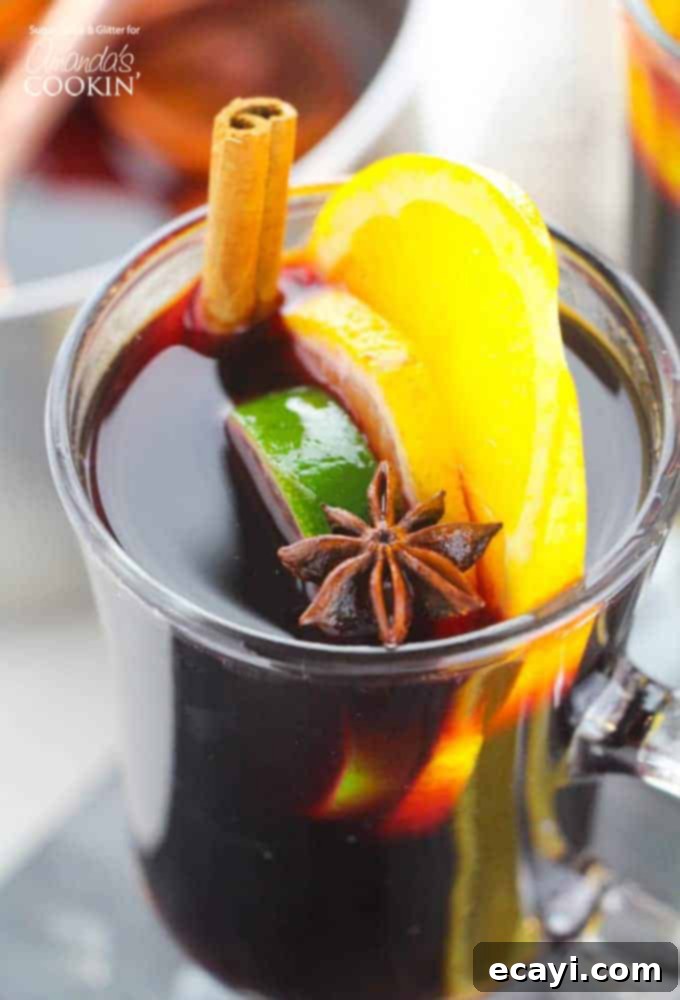 Classic Mulled Wine: Your Perfect Holiday Beverage A steaming mug of festive mulled wine, garnished with orange slices and cinnamon sticks, perfect for holiday gatherings