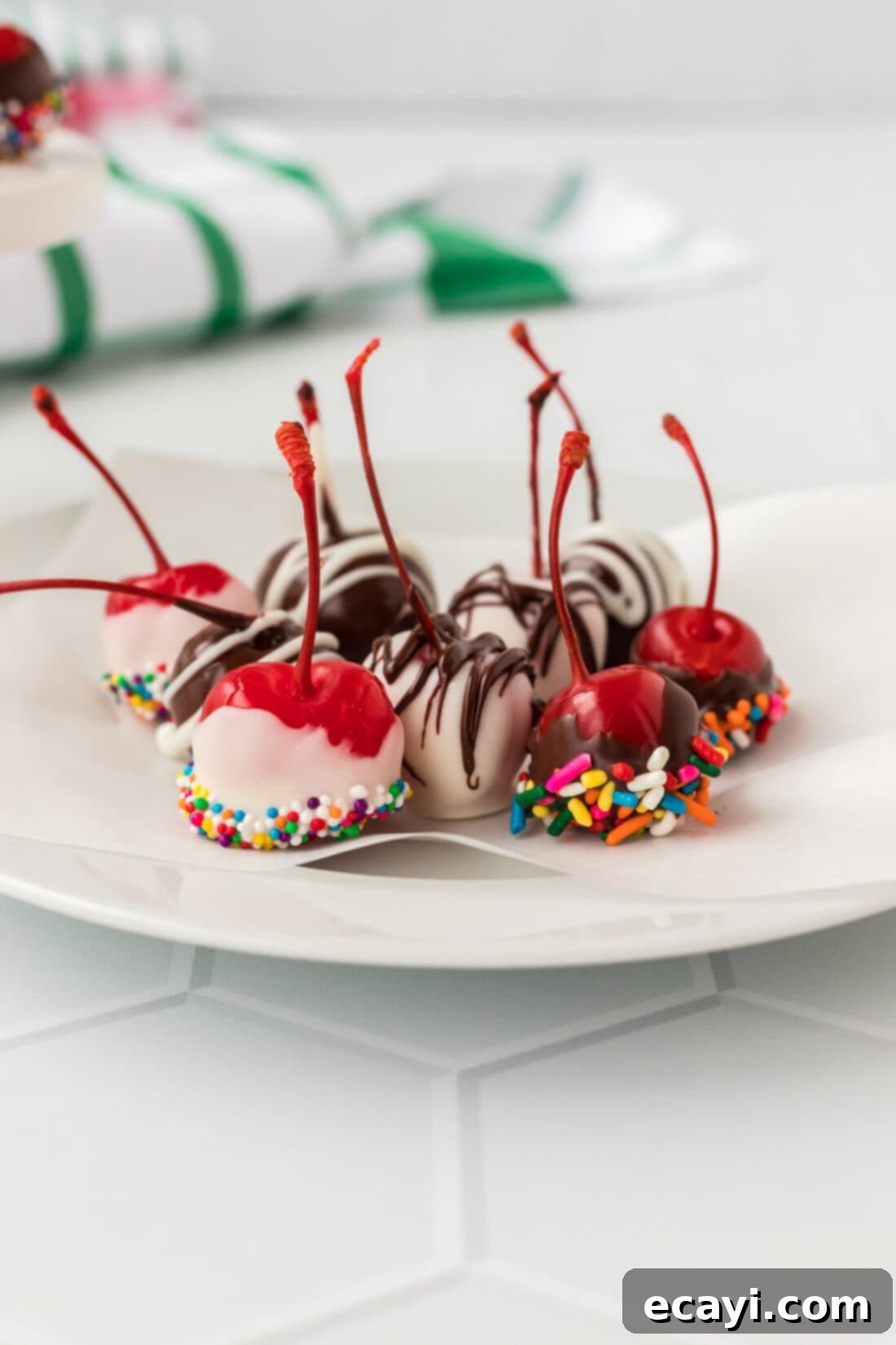 Crimson Edge 3 Decadent chocolate-dipped spiked cherries presented beautifully on a white plate.