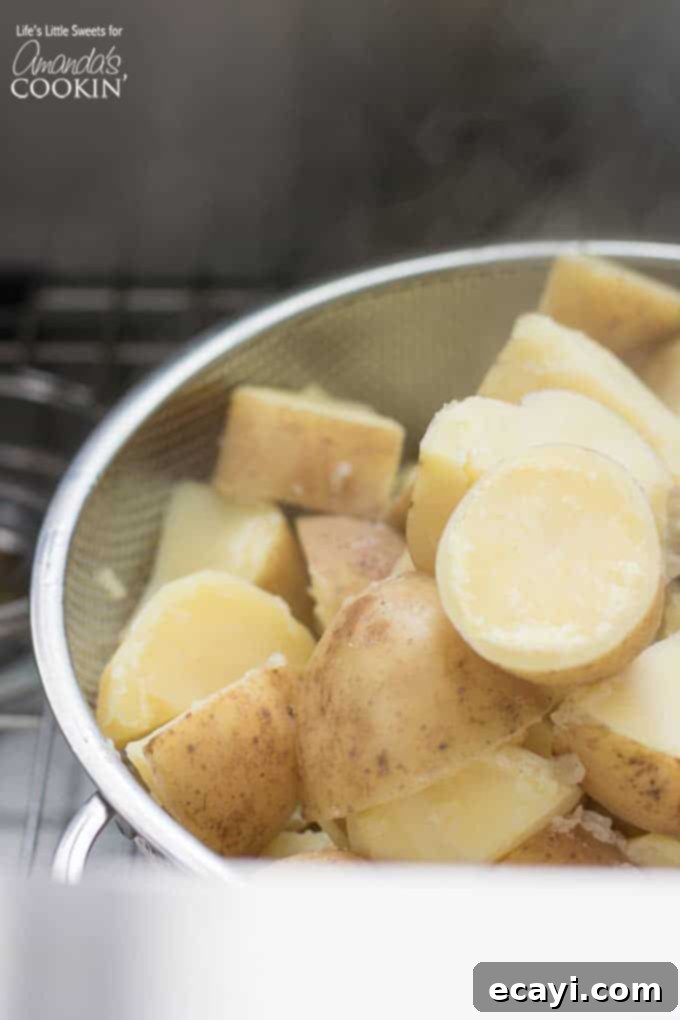 Velvety Mashed Potatoes 4 cut cooked potatoes in a colander