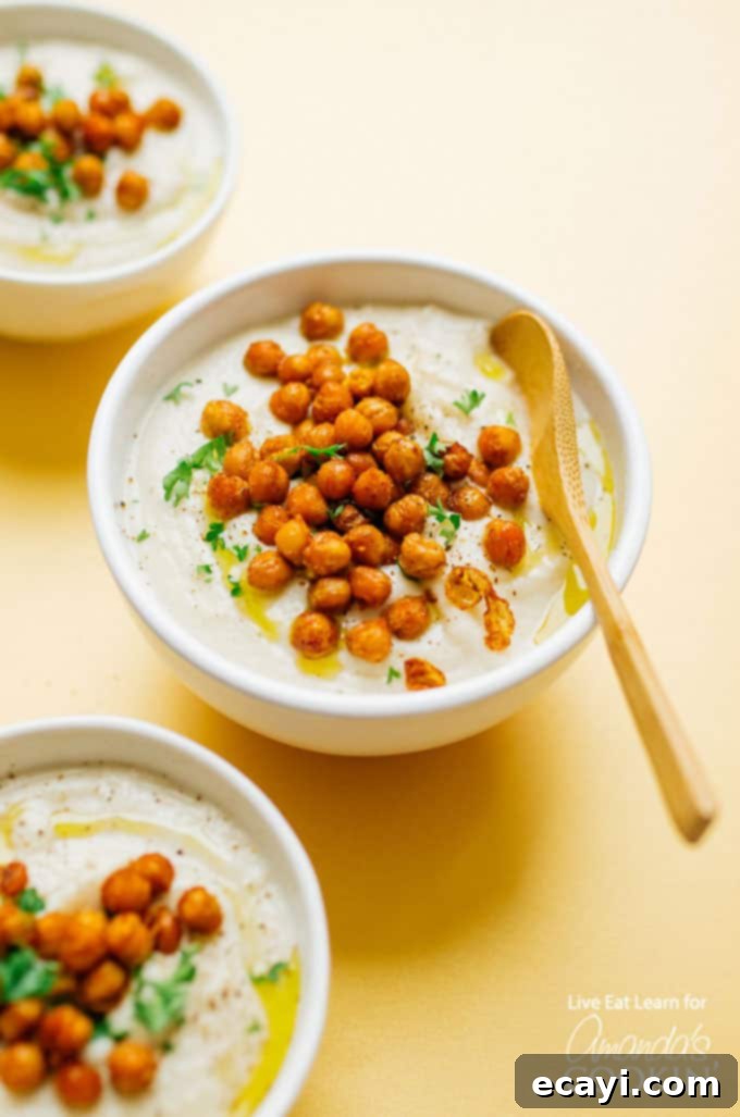 Crockpot Creamy Cauliflower Soup: the perfect slow cooker dinner recipe! Crockpot creamy cauliflower soup in bowls with chickpeas
