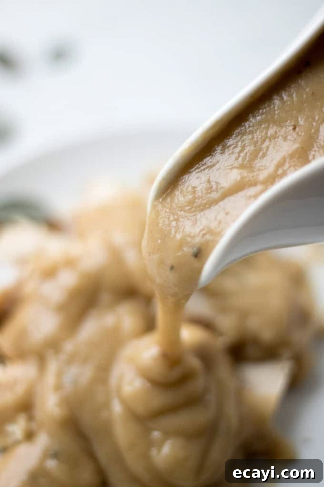 Perfect Turkey Gravy From Scratch 13 Homemade Turkey Gravy pouring out of a gravy boat