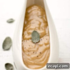 Perfect Turkey Gravy From Scratch 14 Close up photo of a gravy boat of Homemade Turkey Gravy