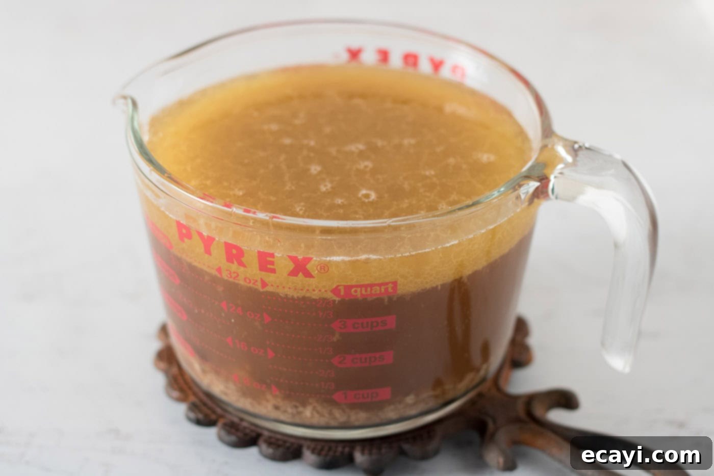 Perfect Turkey Gravy From Scratch 8 Wet measuring cup of broth and roasted turkey drippings