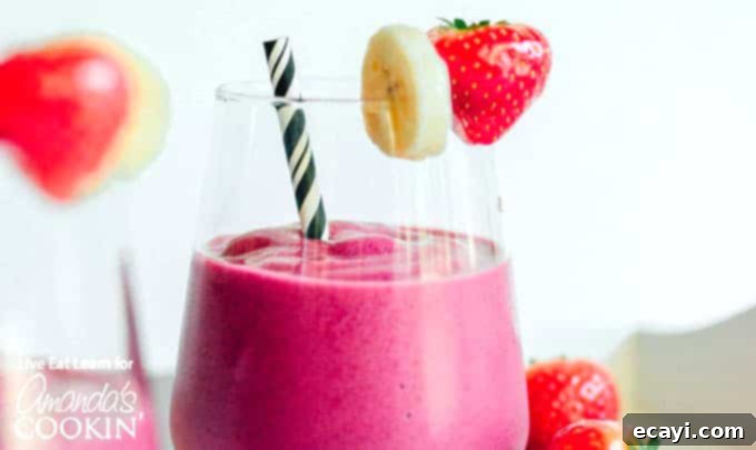 Strawberry Beet Glow 4 Side view of a Strawberry Beet Smoothie, showcasing its vibrant color and creamy texture
