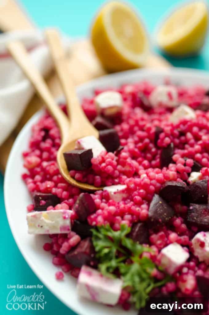 Discover the vibrant and refreshing Pearl Couscous Salad with Feta and Beet – a healthy, easy-to-make side dish perfect for any meal. #couscous #feta #beets #dinnersides #sidedish #healthy #healthysides #salad #sidesalad #vegetarian Pearl Couscous Salad with Feta and Beet in a beautiful bowl, garnished with fresh herbs, ready to be served.