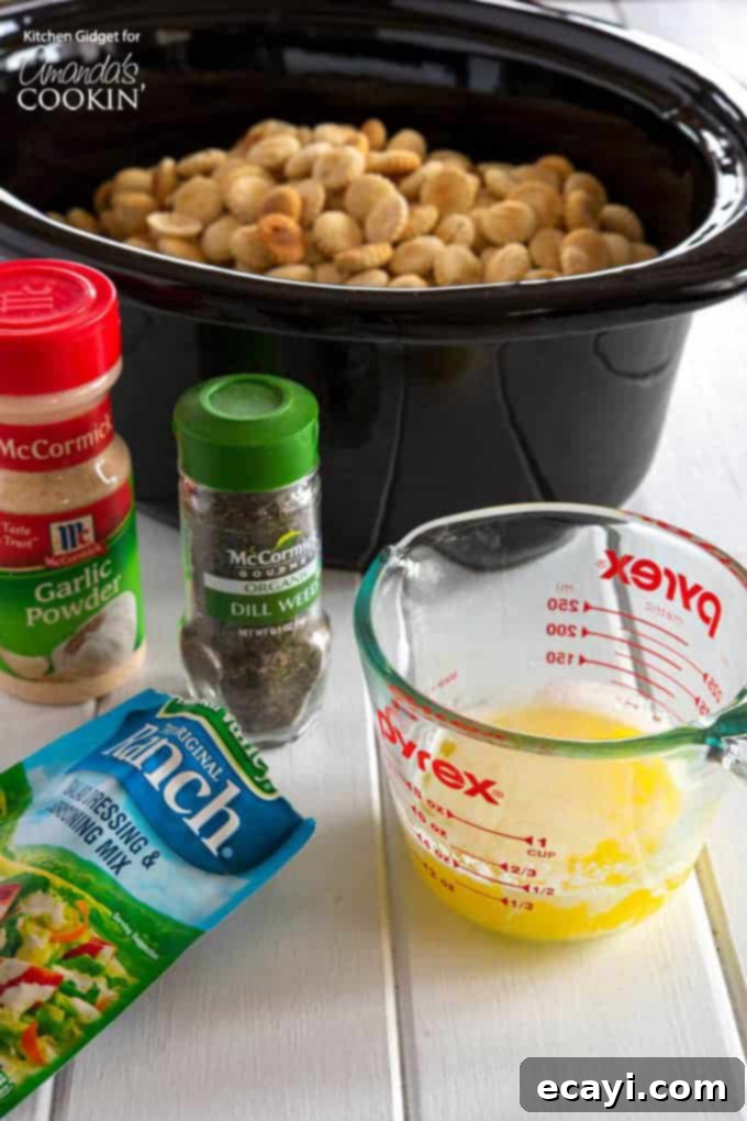 Ingredients for ranch seasoned oyster crackers: Essential components including butter, dry ranch mix, dried dill, garlic powder, black pepper, and classic oyster crackers. #appetizers #appetizerrecipes #oystercrackers #superbowl #gamedayappetizers #gameday #crockpot #garlic #slowcooker #ranch #partyfood #partyappetizers All ingredients laid out for making ranch seasoned oyster crackers: butter, ranch mix, dill, garlic powder, pepper, and oyster crackers